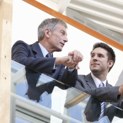 Businessmen having conversation in modern office